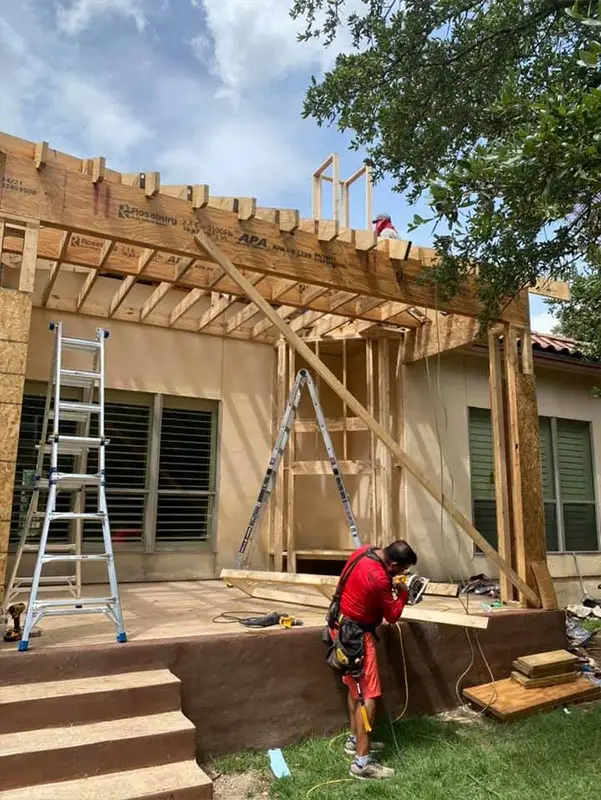 Getting roof on and tied in rain