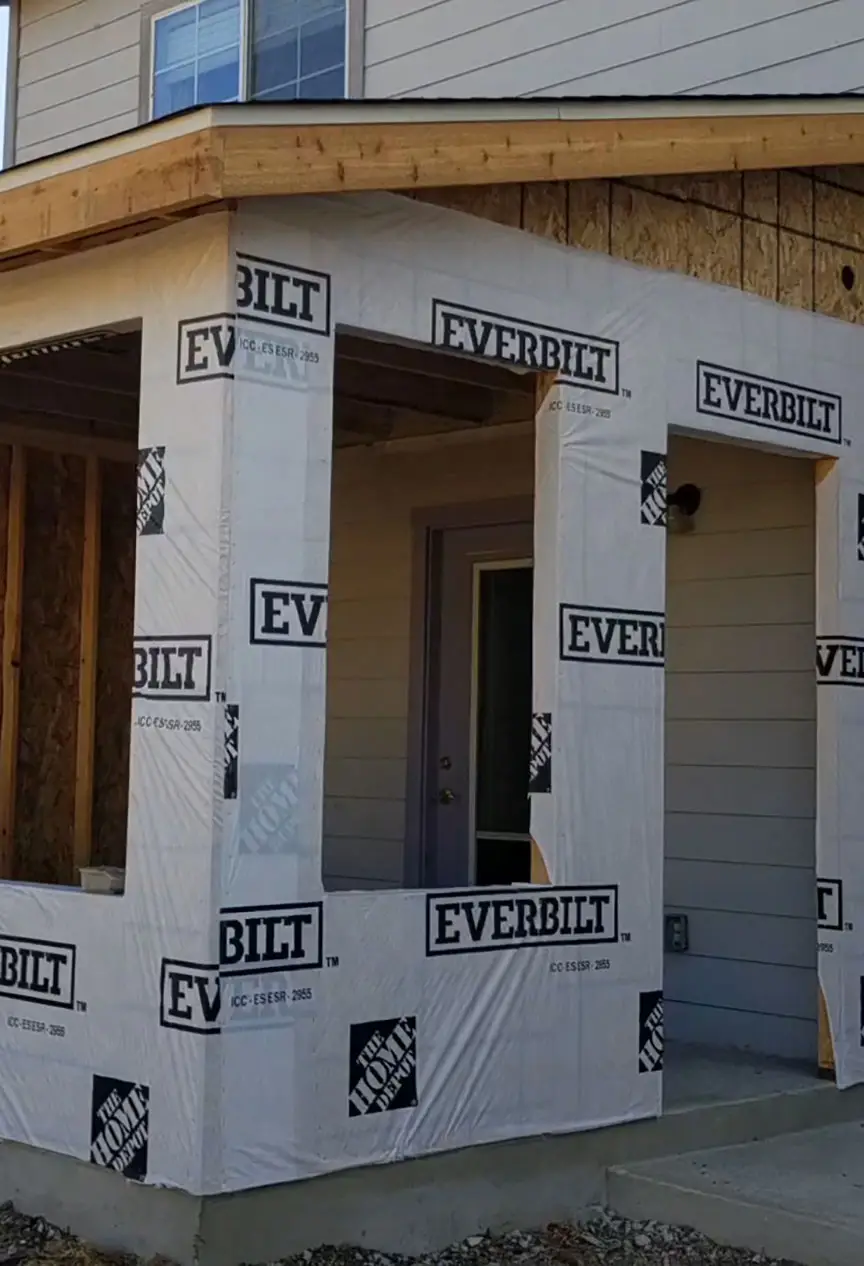 Plywood and house wrap installed